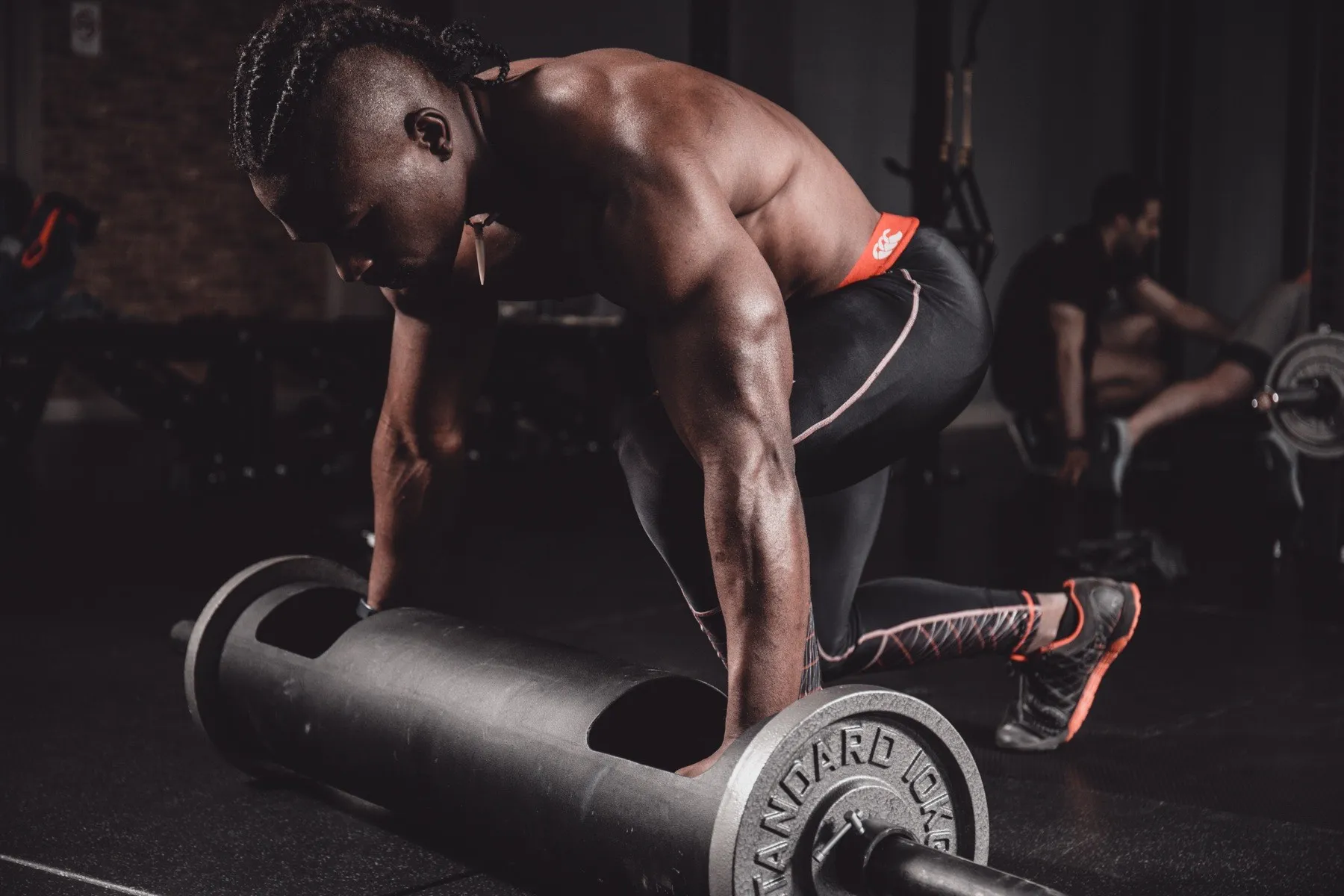 Coach Patient setting a barbell during a training session